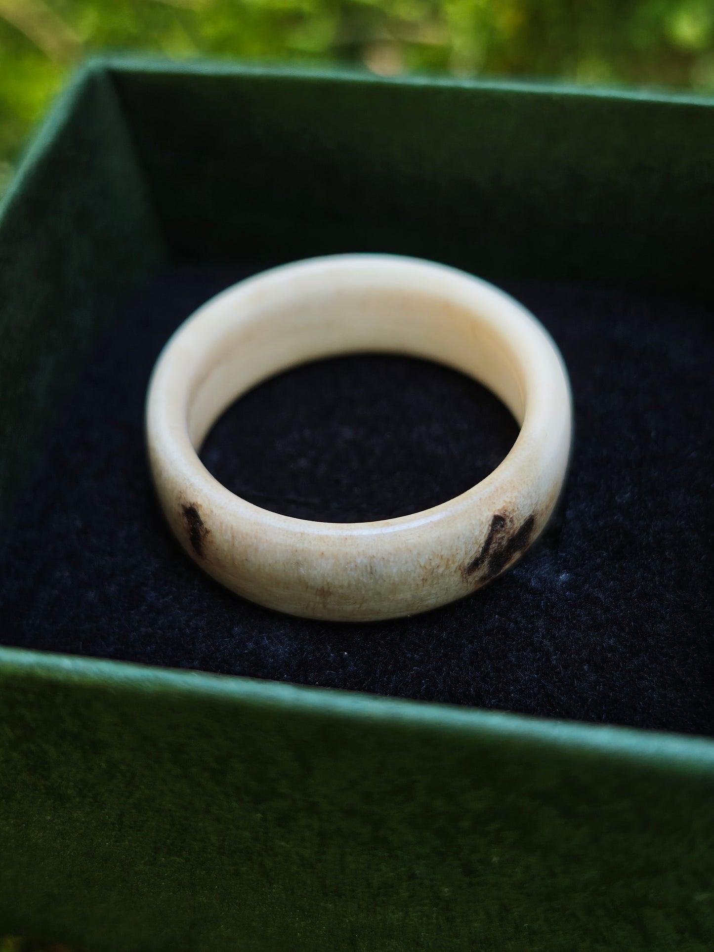 The antler ring in a gift box